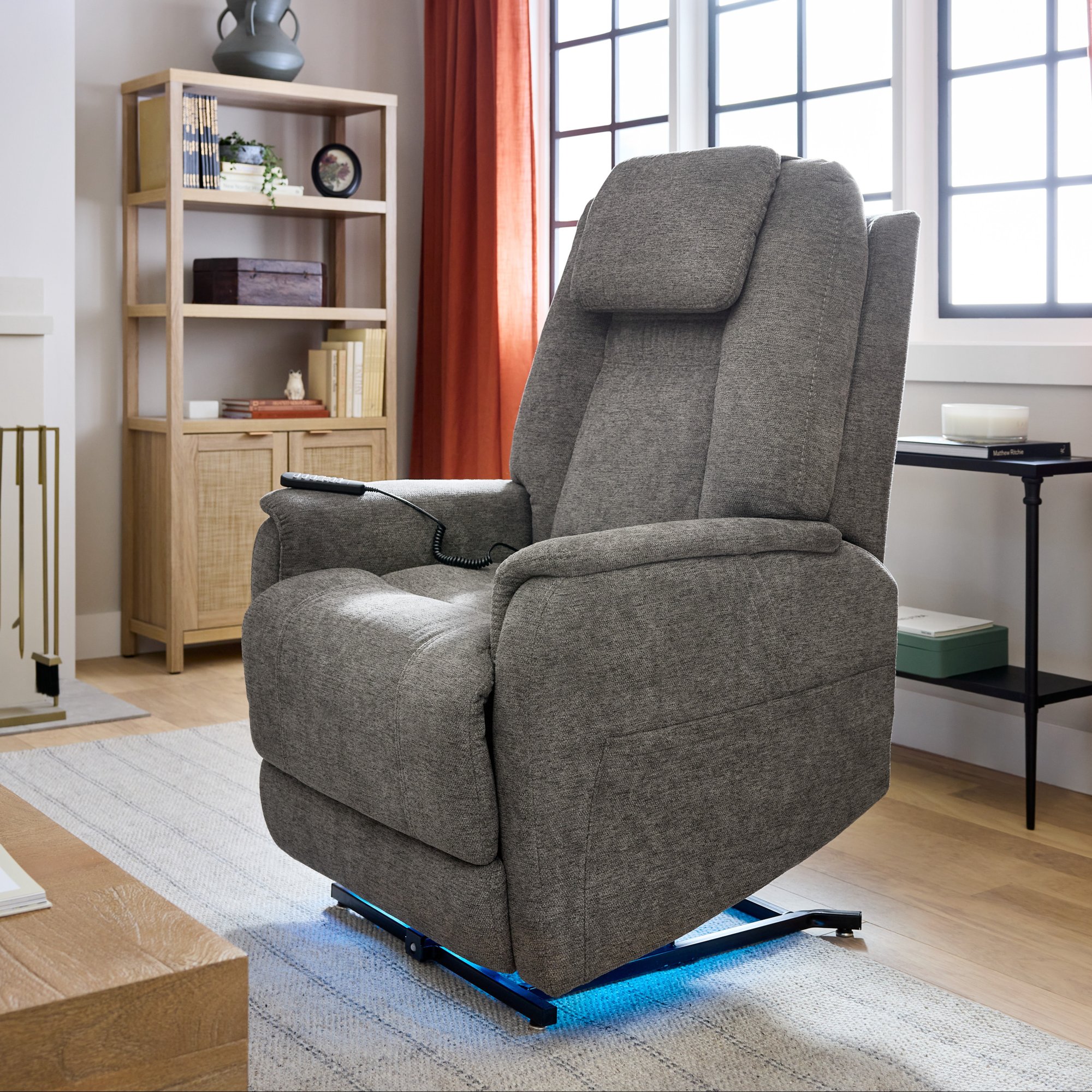 Dark gray Zecliner Model 3+ product image featured in a living room 